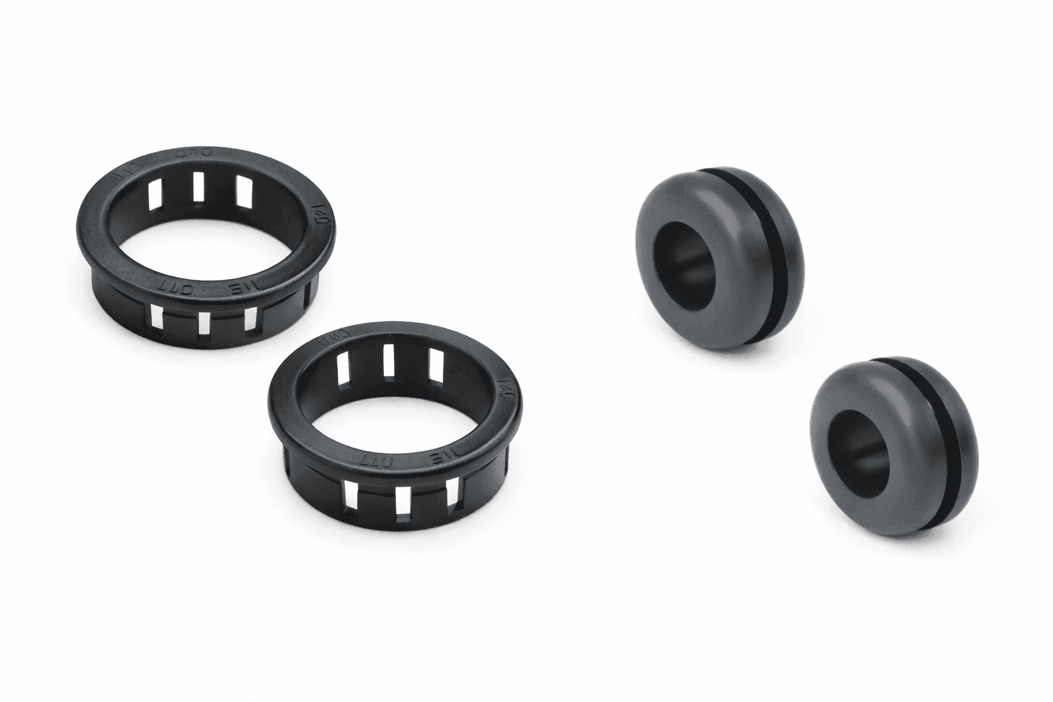 Bushings & Grommets Black rubber bushings and grommets for protecting wires and cables through panel openings